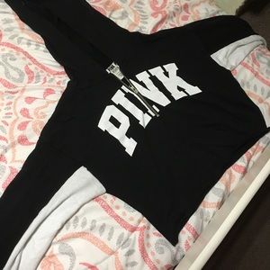 A cropped pink hoodie